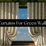 curtains-for-green-walls-curtains | Drapery Company Curtains drawn open in front of a window with a black banner reading 'Curtains For Green Walls' over a tropical green leaf wallpaper backdrop.