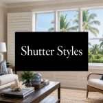 plantation-shutters-styles-living-room | Drapery Company Living room with beige walls, white sofa, blue pillows, and a central TV displaying 'Shutter Styles' over a palm-filled window view.