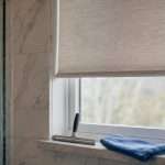 Bathroom window with roller shade installing