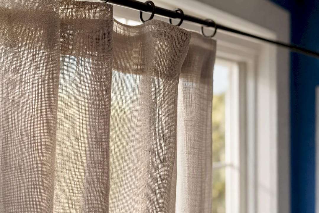 Detailed close-up of sheer curtain fabric weave
