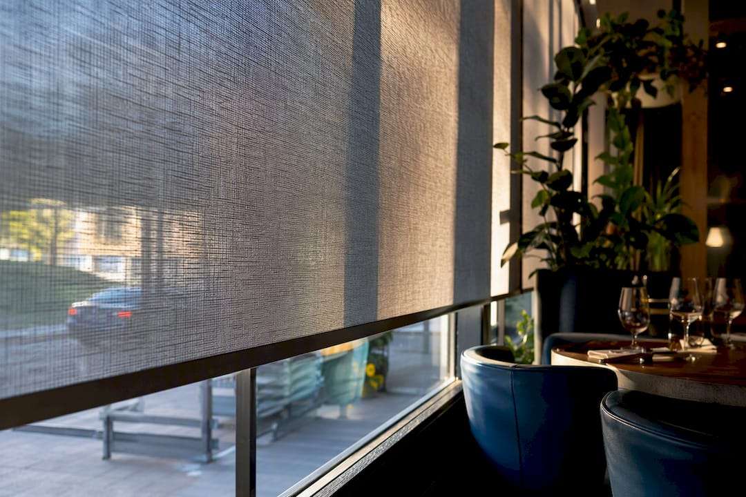 Close-up of restaurant shade fabric filtering light