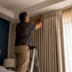 1787877236277_Installer-attaching-custom-pleated-drapery-header | Drapery Company Installer attaching custom pleated drapery header