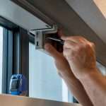 Installer securing window treatment hardware