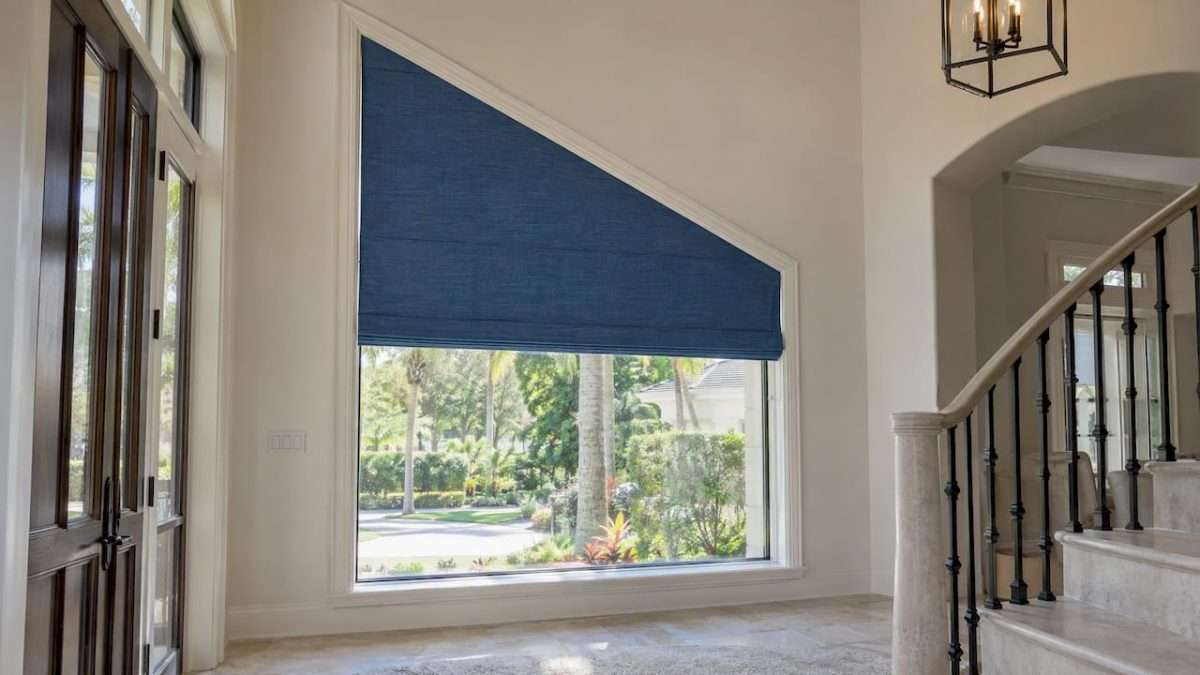 Blue shade fitted to an angled foyer window