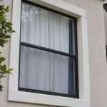 1792463762738_White-backed-curtains-seen-from-a-townhouse-exterior | Drapery Company White-backed curtains seen from a townhouse exterior
