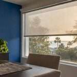 Solar shade softens late sun at west-facing window